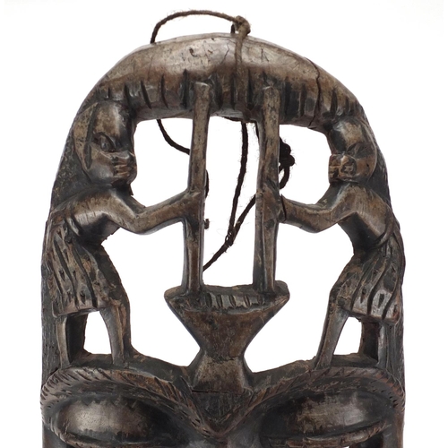 487 - Large African tribal carved wooden face mask, 58cm high