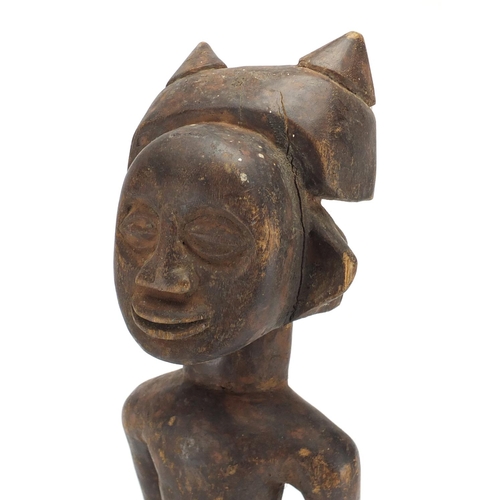 488 - African tribal carved wooden fertility doll, 54cm high