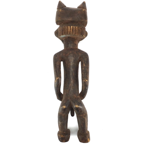 488 - African tribal carved wooden fertility doll, 54cm high