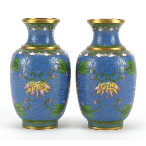 529 - Pair of Chinese cloisonné vases, both enamelled with flower heads and foliate scrolls, each 11cm hig... 