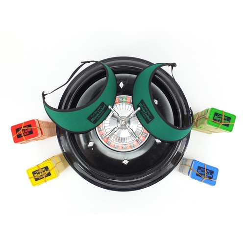 560 - Table top roulette wheel, with chips, 35cm in diameter