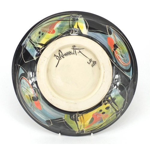 589 - Studio pottery bowl with colourful glaze, 30cm in diameter