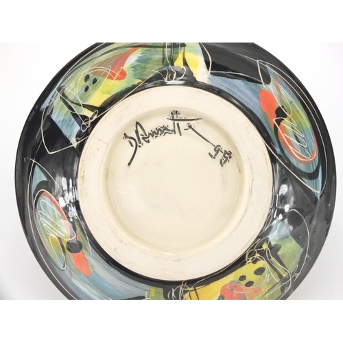 589 - Studio pottery bowl with colourful glaze, 30cm in diameter