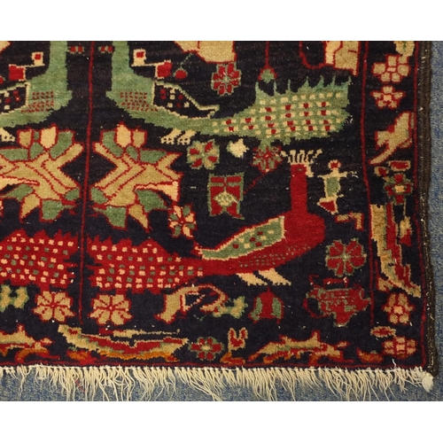 2027 - Rectangular Karaja rug, having a stylised bird and flower design, 138cm x 77.5cm