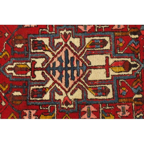 2034 - Rectangular Karabagh carpet runner, having a stylised repeat medallion design with flowers onto a re... 