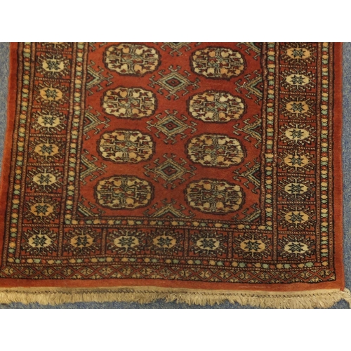 2044 - Rectangular Pakistan Bukhara carpet runner, 307cm x 79cm
