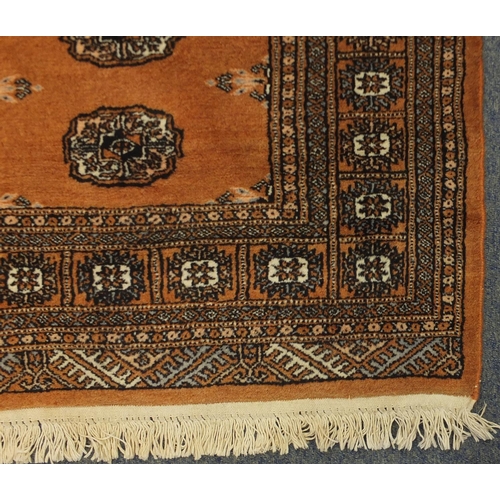 2019 - Rectangular Pakistan Bukhara rug, the central field having a repeat medallion design, with correspon... 