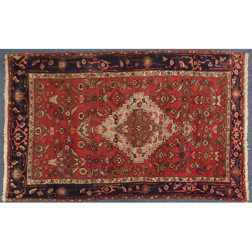 2011 - Rectangular Persian Hamadan type rug, having a stylised floral design with central medallion and cor... 