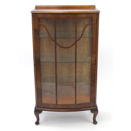 32 - Walnut bow fronted display cabinet, fitted with three glass shelves, 115cm H x 60cm W x 30cm D