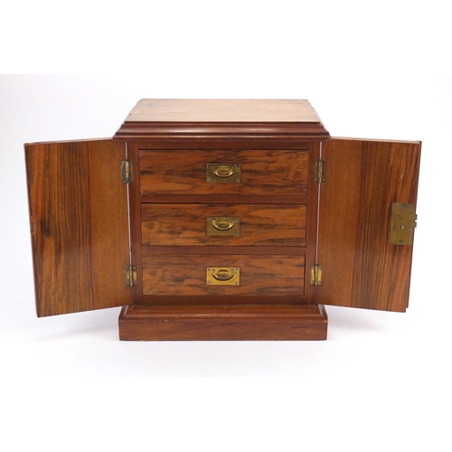 44 - Victorian walnut specimen chest with a pair of doors enclosing three drawers with inset brass handle... 