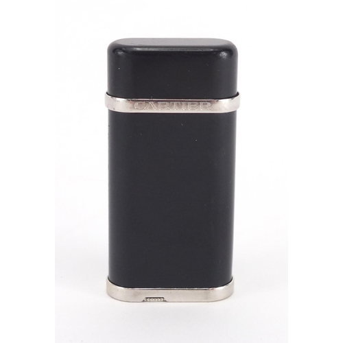 60 - Cartier black enamel pocket lighter, with fitted box, serial number 119530, 6cm high