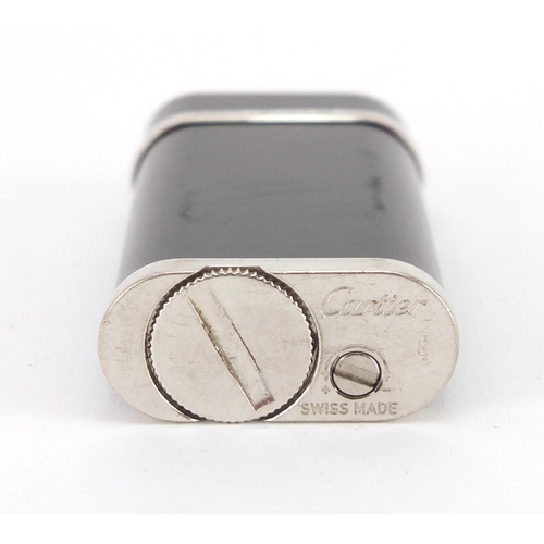 60 - Cartier black enamel pocket lighter, with fitted box, serial number 119530, 6cm high