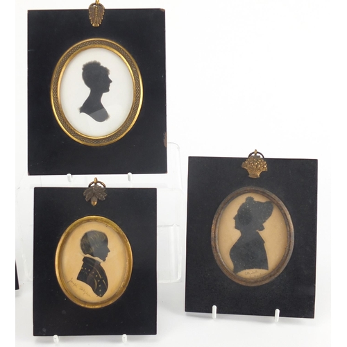 18 - Five 19th century oval silhouette portraits including four hand painted, one inscribed Isabella Dodg... 