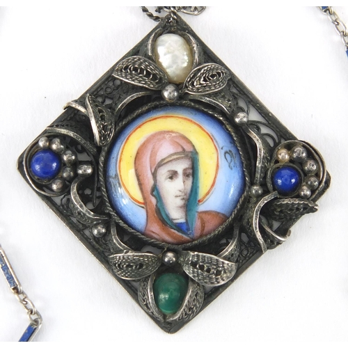 21 - Silver Filigree pendant with central enamel panel, hand painted with a portrait of Madonna, set with... 