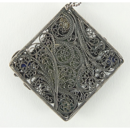 21 - Silver Filigree pendant with central enamel panel, hand painted with a portrait of Madonna, set with... 