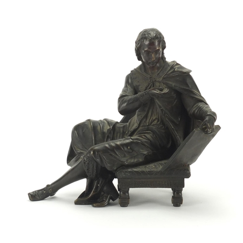 34 - Patinated bronze study of a figure, seated reading, 19cm high