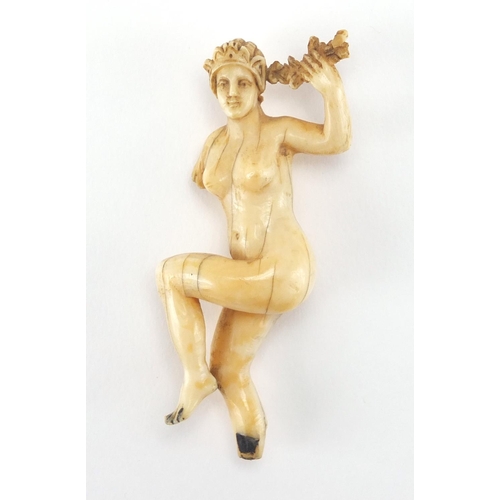 28 - Antique ivory carving of a nude female, 8.2cm high