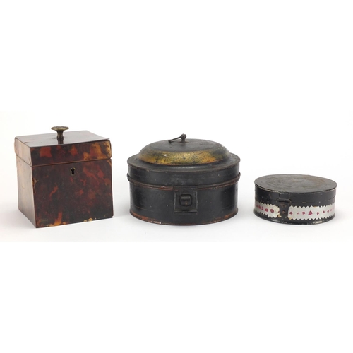 46 - 19th century red tortoiseshell tea caddy and two antique tin spice boxes, the largest 15cm in diamet... 