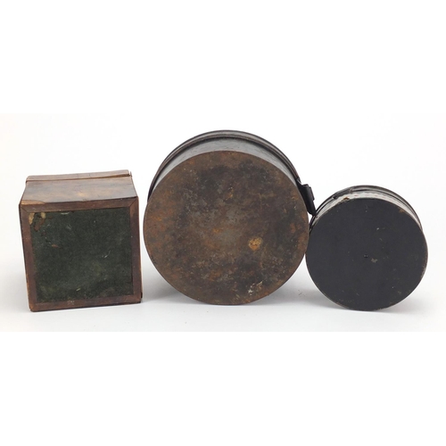 46 - 19th century red tortoiseshell tea caddy and two antique tin spice boxes, the largest 15cm in diamet... 