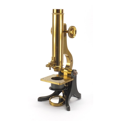 55 - Adjustable brass microscope by J H Steward of The Strand London, with lenses and accessories, housed... 