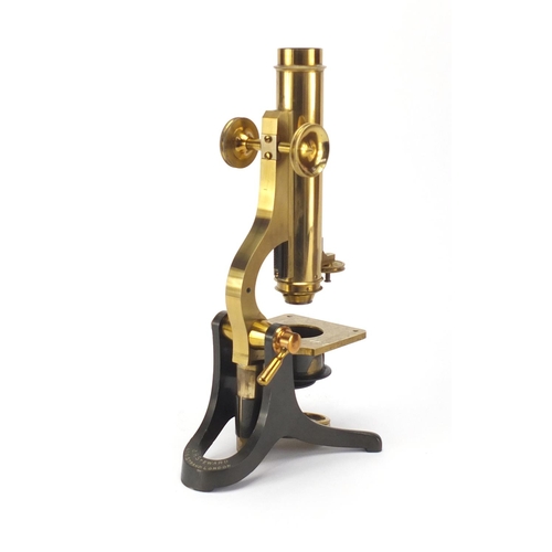 55 - Adjustable brass microscope by J H Steward of The Strand London, with lenses and accessories, housed... 