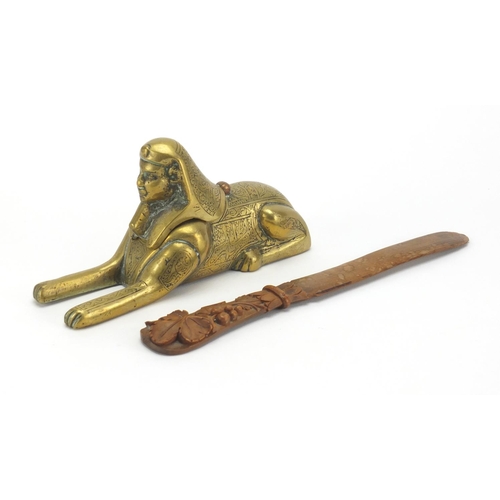 39 - Brass Cairoware inkwell in the form of a Sphinx and a carved Black Forest page turner, the largest 2... 