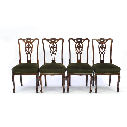 9 - Set of four carved walnut chairs with green padded seats, 97cm high