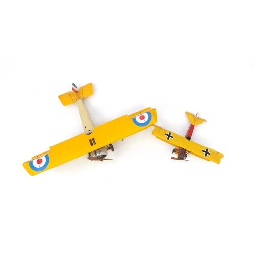 2057 - Two model biplanes, the largest 50cm in length