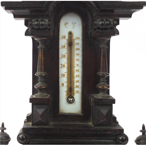 2051 - Black Forest style wall barometer/thermometer, with brass columns, 67cm high