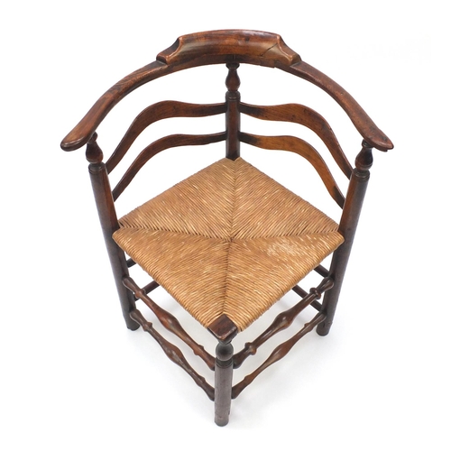 2020 - Antique carved oak corner chair, with cane seat, 80cm high