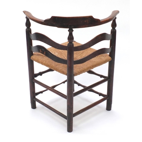2020 - Antique carved oak corner chair, with cane seat, 80cm high