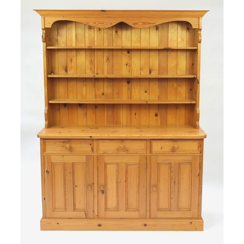 2021 - Pine dresser fitted with an open plate rack above cupboard doors and drawers, 200cm H x 153cm W x 47... 