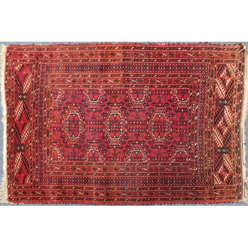 2036 - Rectangular Pakistan rug, having an all over geometric design with corresponding borders onto a red ... 