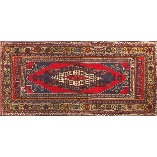 2012 - Rectangular Taspinar rug having an all over floral and geometric design, 297cm x 142cm