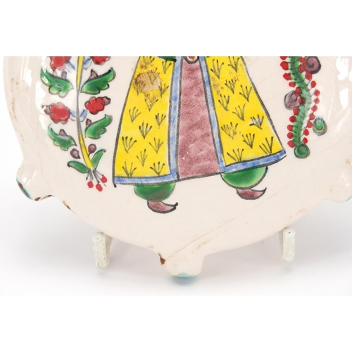 602 - Armenian ceramic water flask, hand painted with two figures in traditional dress, 15cm high