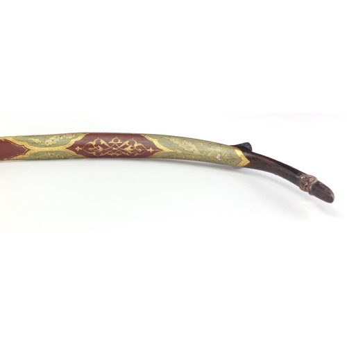 606 - Ottoman lacquered hunting bow of curved form, finely hand painted and gilded with flowers, 89cm in l... 