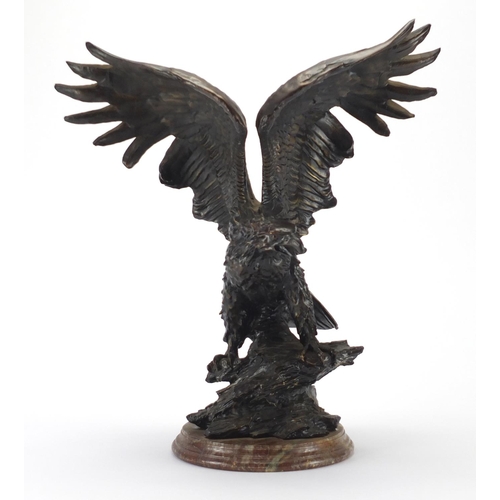 2251 - Bronzed study of a bald eagle on a circular stepped marble base, 42cm high