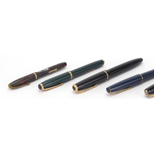 126 - Six vintage fountain pens and a Parker 17 propelling pencil including Watermans and marbleised Conwa... 