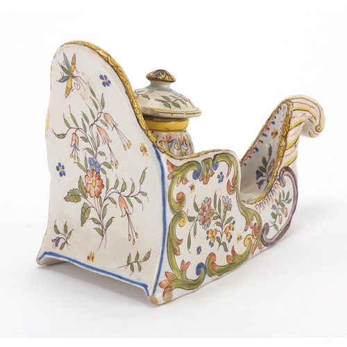 730 - Continental faience glazed pottery inkwell, hand painted with flowers, 18.5cm in length