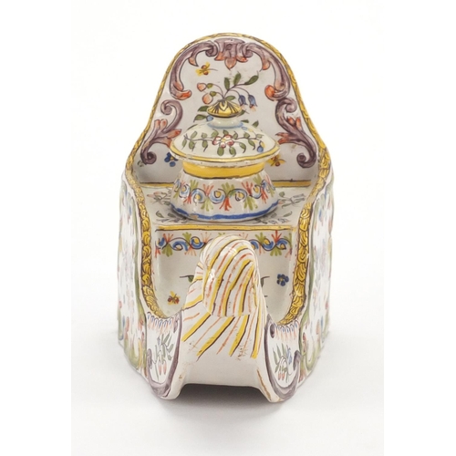 730 - Continental faience glazed pottery inkwell, hand painted with flowers, 18.5cm in length