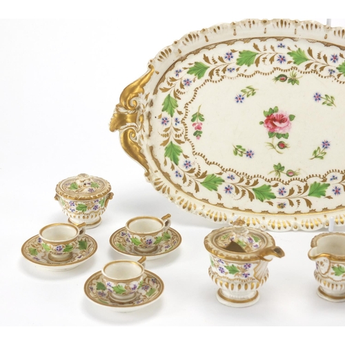 736 - 19th century dolls house porcelain tea service with tray, hand painted and gilded with flowers, the ... 
