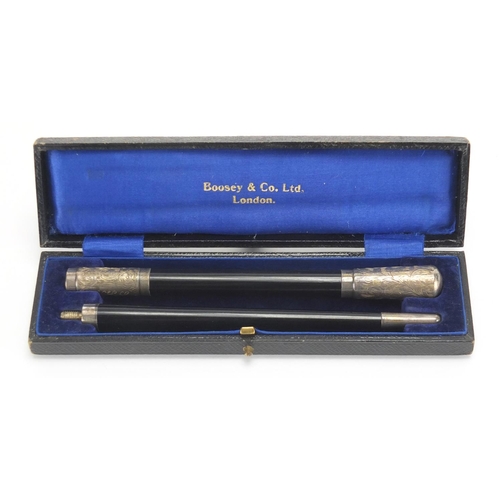 136 - Two piece ebonised conductors baton with silver mounts, housed in a velvet and silk lined Boosey & C... 