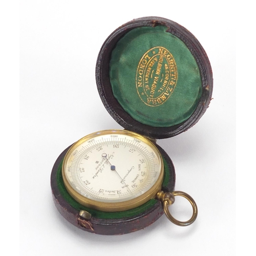 118 - Brass pocket compensated barometer by Negretti and Zambra of London, housed in a silk and velvet lin... 