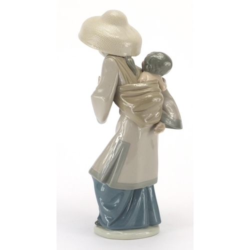 2440 - Lladro figurine of an Oriental mother with child, 27cm high