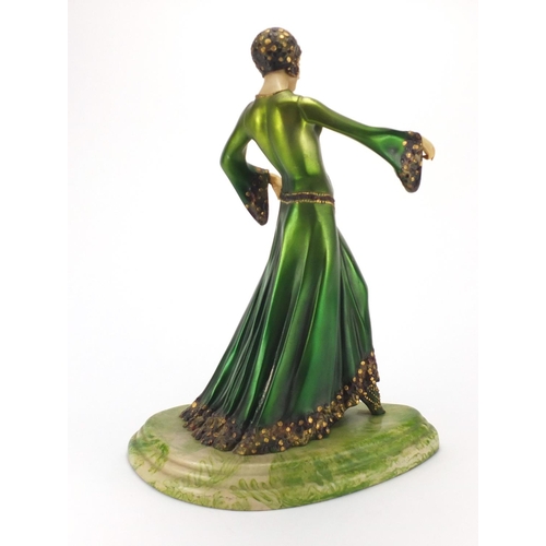 2247 - Bronze style figurine of an Art Deco dancer on a shaped marbleised base, 49cm high