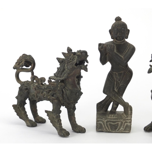 2272 - Two Oriental bronze dragons and a carved stone figure, the largest 17cm high