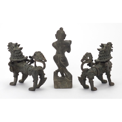 2272 - Two Oriental bronze dragons and a carved stone figure, the largest 17cm high