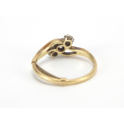 2603 - Unmarked gold clear stone crossover ring, size L, approximate weight 2.5g