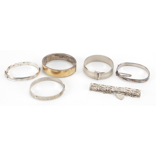 2697 - Six silver bangles and bracelets, some with chased and engine turned decoration, approximate weight ... 