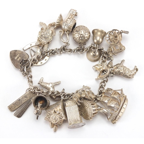 2802 - Silver charm bracelet with a selection of silver charms including carriage, telephone box and animal... 